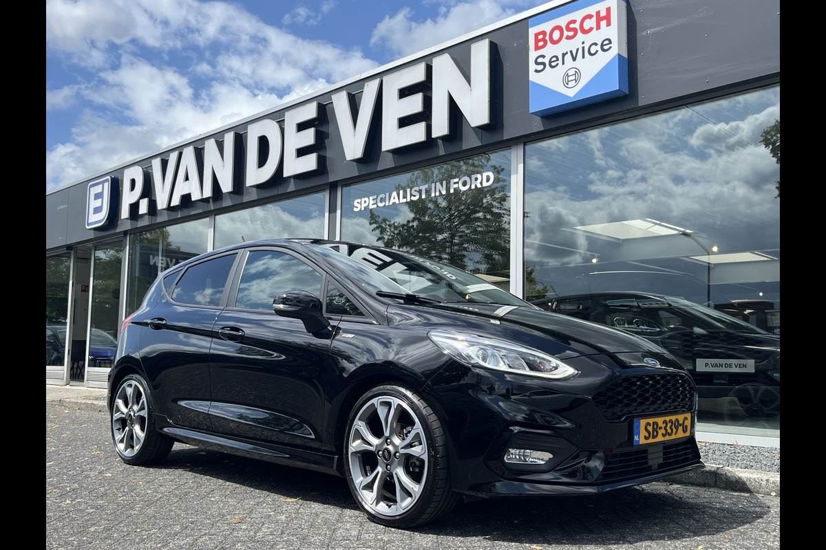 Ford Fiesta 1.0 EcoBoost ST-Line 5drs 100pk/74kW 6-bak | Afn. trekhaak | Bang & Olufsen | Keyless Entry | 18'' | Comfort Pack | Navigatie Audio Pack | Driver Assistance Pack | etc. etc. Ford Fiesta 1.0 EcoBoost ST-Line 5drs 100pk/74kW 6-bak | Afn. trekhaak | Bang & Olufsen | Keyless Entry | 18'' | Comfort Pack | Navigatie Audio Pack | Driver Assistance Pack | etc. etc.