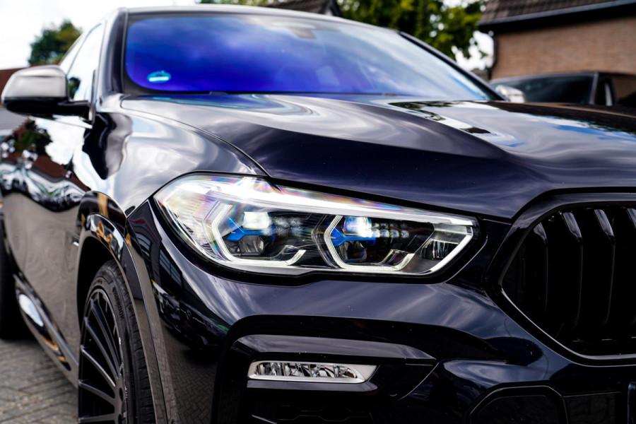 BMW X6 M50i High Executive | Carbon inleg | Krystallen Pook | Harman/Kardon | X6M look | 360 | Uitlaatklep | BMW Drive Assisted |