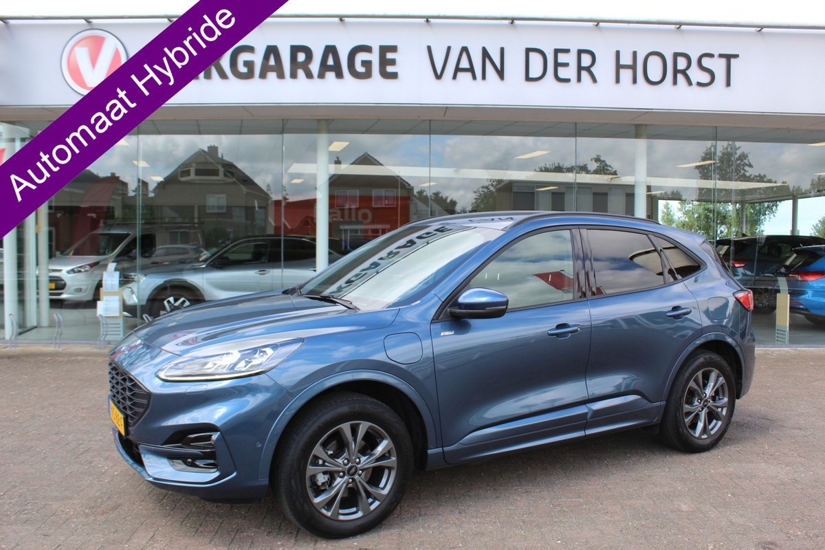 Ford Kuga 2.5-225pk PHEV ST-Line X. , Mooie Hoge zit , 1500kg Trekgewicht Hybride rijden voor een redelijke prijs ! Stoel- en voorraamverwarming, B&O soundsystem, navigatie, telefoonvoorb., metallic lak, LM wielen, side- en lane assist, camera v+a, adaptive cruise control, elektr. achterklep etc., etc. Ford Kuga 2.5-225pk PHEV ST-Line X. , Mooie Hoge zit , 1500kg Trekgewicht Hybride rijden voor een redelijke prijs ! Stoel- en voorraamverwarming, B&O soundsystem, navigatie, telefoonvoorb., metallic lak, LM wielen, side- en lane assist, camera v+a, adaptive cruise control, elektr. achterklep etc., etc.