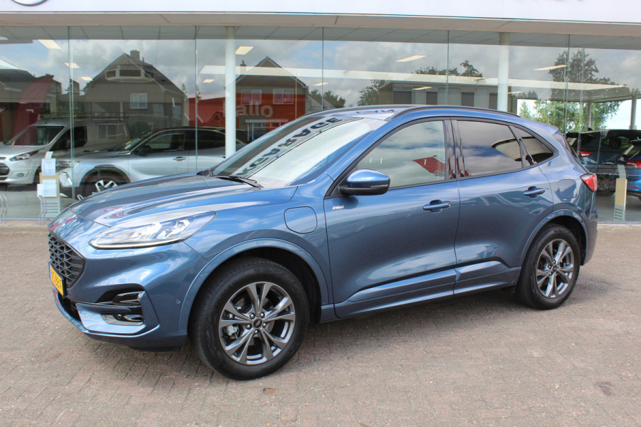 Ford Kuga 2.5-225pk PHEV ST-Line X. , Mooie Hoge zit , 1500kg Trekgewicht Hybride rijden voor een redelijke prijs ! Stoel- en voorraamverwarming, B&O soundsystem, navigatie, telefoonvoorb., metallic lak, LM wielen, side- en lane assist, camera v+a, adaptive cruise control, elektr. achterklep etc., etc.
