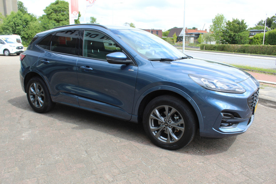 Ford Kuga 2.5-225pk PHEV ST-Line X. , Mooie Hoge zit , 1500kg Trekgewicht Hybride rijden voor een redelijke prijs ! Stoel- en voorraamverwarming, B&O soundsystem, navigatie, telefoonvoorb., metallic lak, LM wielen, side- en lane assist, camera v+a, adaptive cruise control, elektr. achterklep etc., etc.