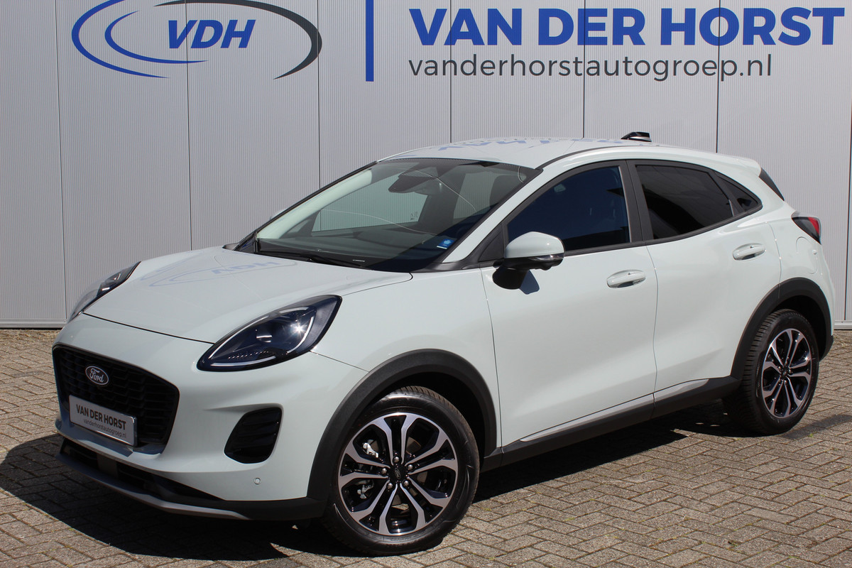 Ford Puma 1.0-125pk EcoBoost Mild-Hybrid Titanium. Nieuw Model ! Van € 35.920,- voor € 27.880,-: ruim €. 8.000,- beneden nieuwprijs. Slechts 9.000km ! Fabrieksgarantie t/m 14-10-2028 ! Lane- en side assist, Navigatie, Telefoonvoorb., Stoel-, stuur- en voorraamverwarming, LED verlichting etc. Ford Puma 1.0-125pk EcoBoost Mild-Hybrid Titanium. Nieuw Model ! Van € 35.920,- voor € 27.880,-: ruim €. 8.000,- beneden nieuwprijs. Slechts 9.000km ! Fabrieksgarantie t/m 14-10-2028 ! Lane- en side assist, Navigatie, Telefoonvoorb., Stoel-, stuur- en voorraamverwarming, LED verlichting etc.