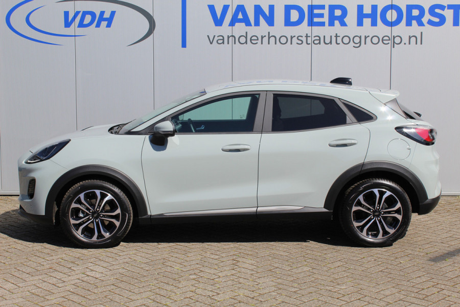 Ford Puma 1.0-125pk EcoBoost Mild-Hybrid Titanium. Nieuw Model ! Van € 35.920,- voor € 27.880,-: ruim €. 8.000,- beneden nieuwprijs. Slechts 9.000km ! Fabrieksgarantie t/m 14-10-2028 ! Lane- en side assist, Navigatie, Telefoonvoorb., Stoel-, stuur- en voorraamverwarming, LED verlichting etc.