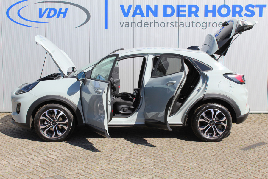 Ford Puma 1.0-125pk EcoBoost Mild-Hybrid Titanium. Nieuw Model ! Van € 35.920,- voor € 27.880,-: ruim €. 8.000,- beneden nieuwprijs. Slechts 9.000km ! Fabrieksgarantie t/m 14-10-2028 ! Lane- en side assist, Navigatie, Telefoonvoorb., Stoel-, stuur- en voorraamverwarming, LED verlichting etc.