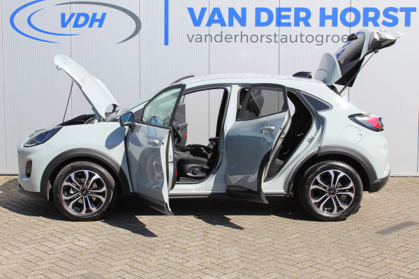 Ford Puma 1.0-125pk EcoBoost Mild-Hybrid Titanium. Nieuw Model ! Van € 35.920,- voor € 27.880,-: ruim €. 8.000,- beneden nieuwprijs. Slechts 9.000km ! Fabrieksgarantie t/m 14-10-2028 ! Lane- en side assist, Navigatie, Telefoonvoorb., Stoel-, stuur- en voorraamverwarming, LED verlichting etc.