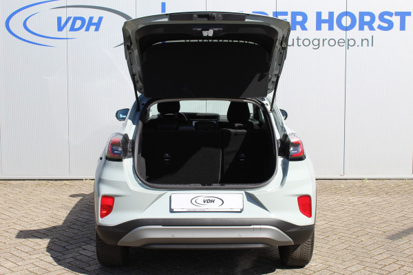 Ford Puma 1.0-125pk EcoBoost Mild-Hybrid Titanium. Nieuw Model ! Van € 35.920,- voor € 27.880,-: ruim €. 8.000,- beneden nieuwprijs. Slechts 9.000km ! Fabrieksgarantie t/m 14-10-2028 ! Lane- en side assist, Navigatie, Telefoonvoorb., Stoel-, stuur- en voorraamverwarming, LED verlichting etc.