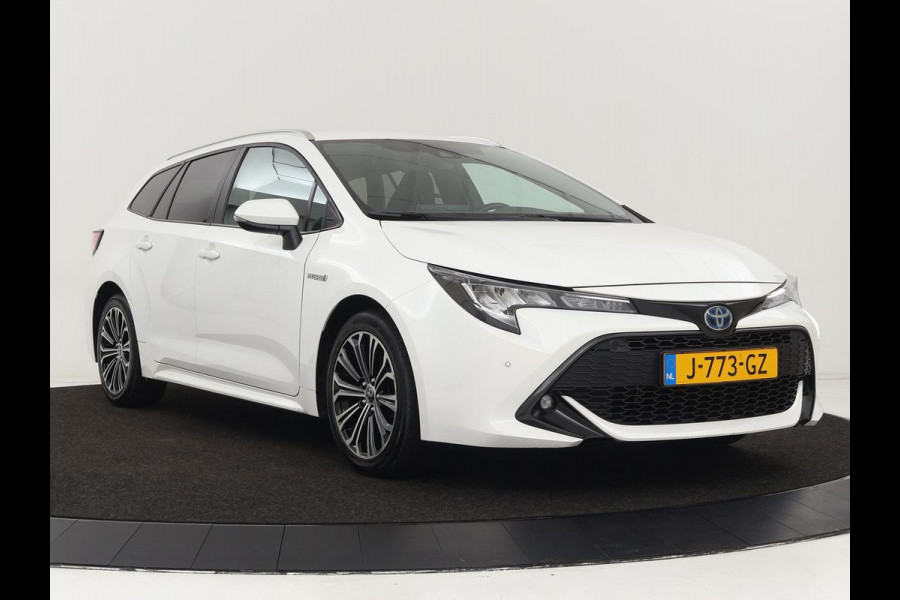 Toyota Corolla 1.8 Hybrid Dynamic | Stoelverwarming | Trekhaak | Camera | Adaptive cruise | Carplay | Navigatie | Parkeerhulp | Climate control