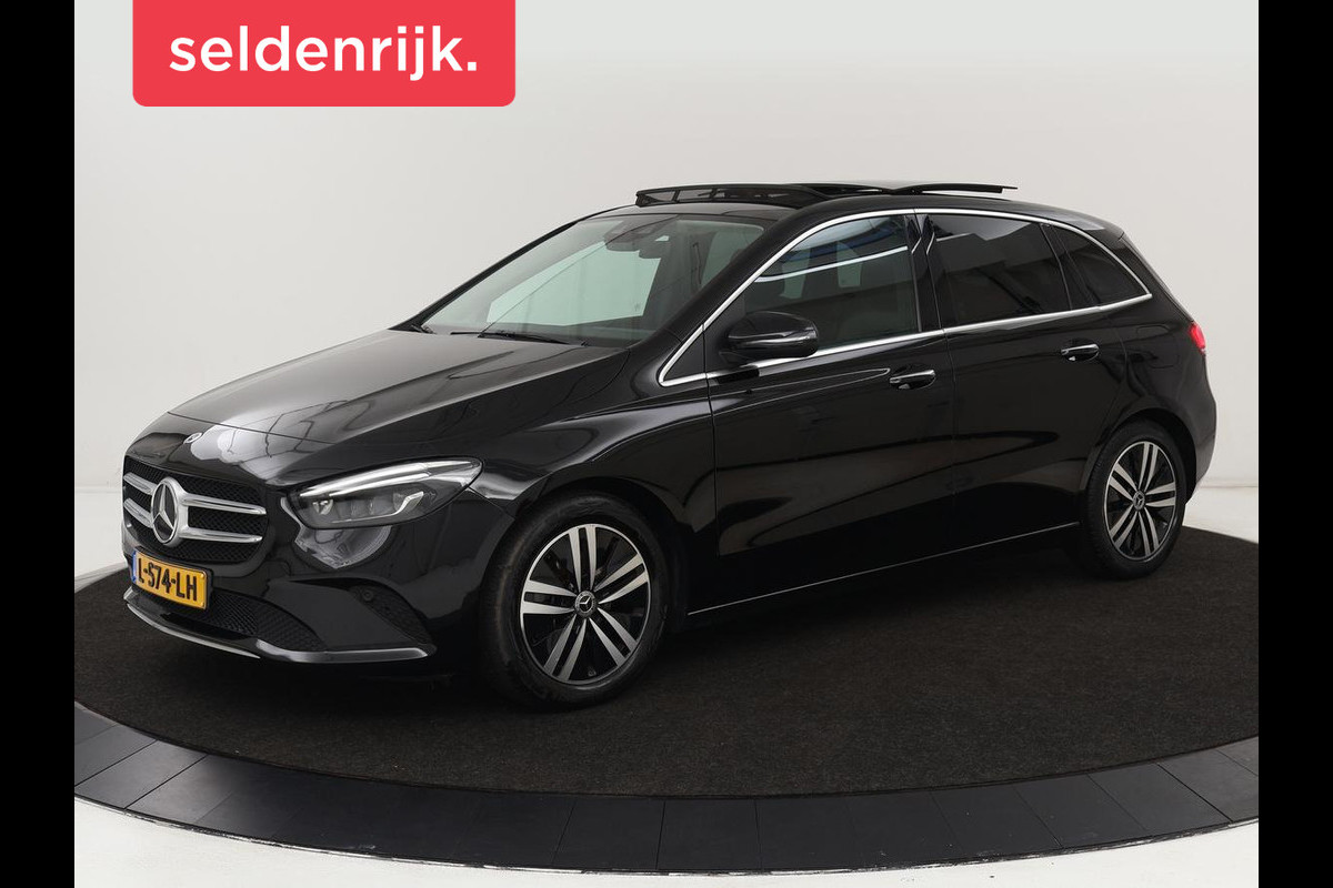 Mercedes-Benz B-Klasse 180 Business Solution Luxury | Panoramadak | Leder | Stoelverwarming | Trekhaak | Memory | Keyless | Matrix LED | Sfeerverlichting | Navigatie | Widescreen Mercedes-Benz B-Klasse 180 Business Solution Luxury | Panoramadak | Leder | Stoelverwarming | Trekhaak | Memory | Keyless | Matrix LED | Sfeerverlichting | Navigatie | Widescreen