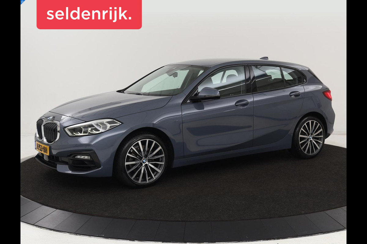 BMW 1-serie 118i Executive Edition | Sport Line | Carplay | Sportstoelen | Half leder | Live Cockpit | Climate control | Parkeerhulp | Cruise control | 'Storm Bay' Metallic BMW 1-serie 118i Executive Edition | Sport Line | Carplay | Sportstoelen | Half leder | Live Cockpit | Climate control | Parkeerhulp | Cruise control | 'Storm Bay' Metallic