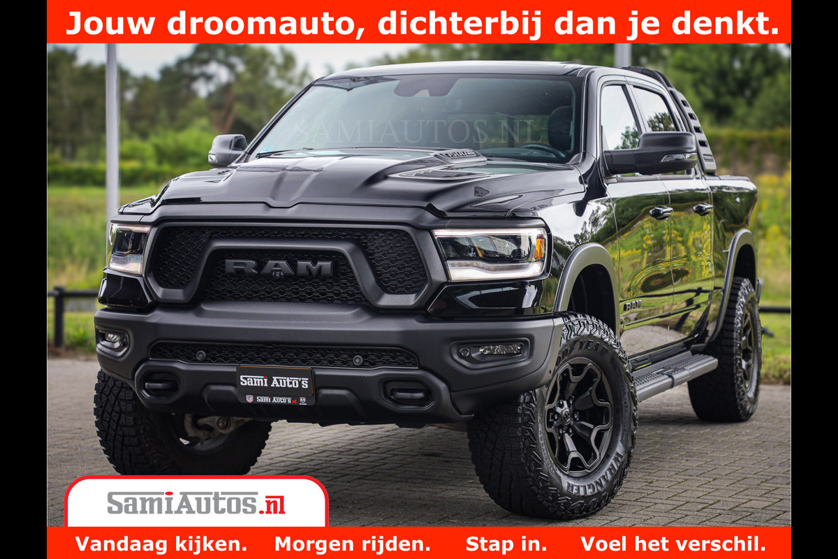 Dodge Ram 1500 REBEL TRX STYLE | BODY LIFT | RAMBAR | 4X4 | LPG | HUD HEADUP | DIGI CLUSTER | 360CAM | ADAPTIVE CRUISE | RAM BAR ROLLCOVER | Comfortabele Dubbele Cabine met Royale 5 Zitplaatsen | Dodge Ram 1500 REBEL TRX STYLE | BODY LIFT | RAMBAR | 4X4 | LPG | HUD HEADUP | DIGI CLUSTER | 360CAM | ADAPTIVE CRUISE | RAM BAR ROLLCOVER | Comfortabele Dubbele Cabine met Royale 5 Zitplaatsen |