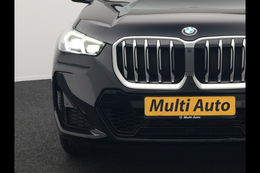 BMW X1 sDrive18i M-Sport Automaat 136pk Dealer O.H. | Trekhaak af Fabriek | Alcantara Sportstoelen Memory & Verwarmd | Camera | Cruise Control | Blis | Park Assist | Apple Carplay | Navigatie | Sfeerverlichting |