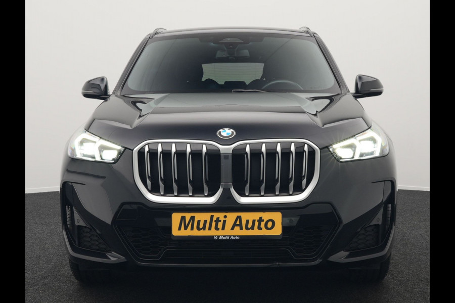 BMW X1 sDrive18i M-Sport Automaat 136pk Dealer O.H. | Trekhaak af Fabriek | Alcantara Sportstoelen Memory & Verwarmd | Camera | Cruise Control | Blis | Park Assist | Apple Carplay | Navigatie | Sfeerverlichting |