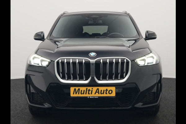 BMW X1 sDrive18i M-Sport Automaat 136pk Dealer O.H. | Trekhaak af Fabriek | Alcantara Sportstoelen Memory & Verwarmd | Camera | Cruise Control | Blis | Park Assist | Apple Carplay | Navigatie | Sfeerverlichting |