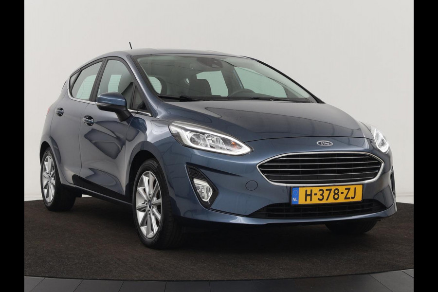 Ford Fiesta 1.0 EcoBoost Titanium | Stoel & stuurverwarming | Trekhaak | Carplay | Climate control | Cruise control | Verwarmde voorruit | Parkeerhulp
