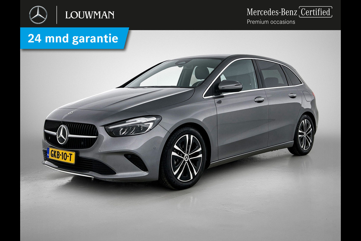 Mercedes-Benz B-Klasse 180 Star Edition Luxury Line | Achteruitrijcamera | Sfeerverlichting | Stoelverwarming |Trekhaak | Keyless Entry | Inclusief 24 maanden MB Certified garantie voor Europa. Mercedes-Benz B-Klasse 180 Star Edition Luxury Line | Achteruitrijcamera | Sfeerverlichting | Stoelverwarming |Trekhaak | Keyless Entry | Inclusief 24 maanden MB Certified garantie voor Europa.