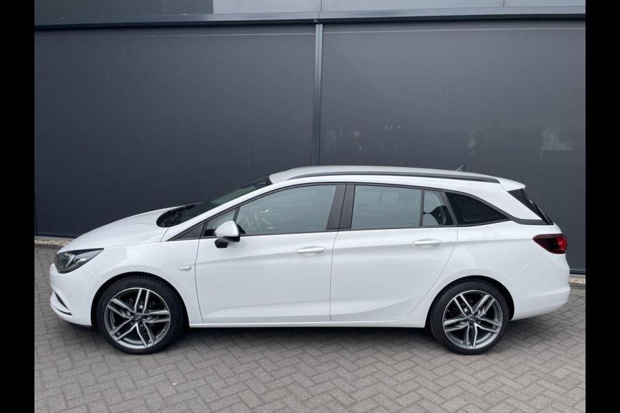 Opel Astra Sports Tourer 1.0 Turbo Online Edition Airco - Cruise control - Parkeersensoren achter - Licht metalen velgen 18 inch - Navigatie - Lederen stuurwiel