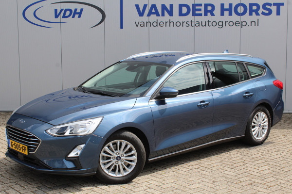Ford FOCUS Wagon 1.0-125pk EcoBoost Titanium Business. Ruime, zeer geschikte gezinsauto ! Autm. airco dual, stoel-, stuur- en voorraamverw., LM wielen, trekhaak, metallic lak, navigatie, telefoonvoorb., cruise control etc