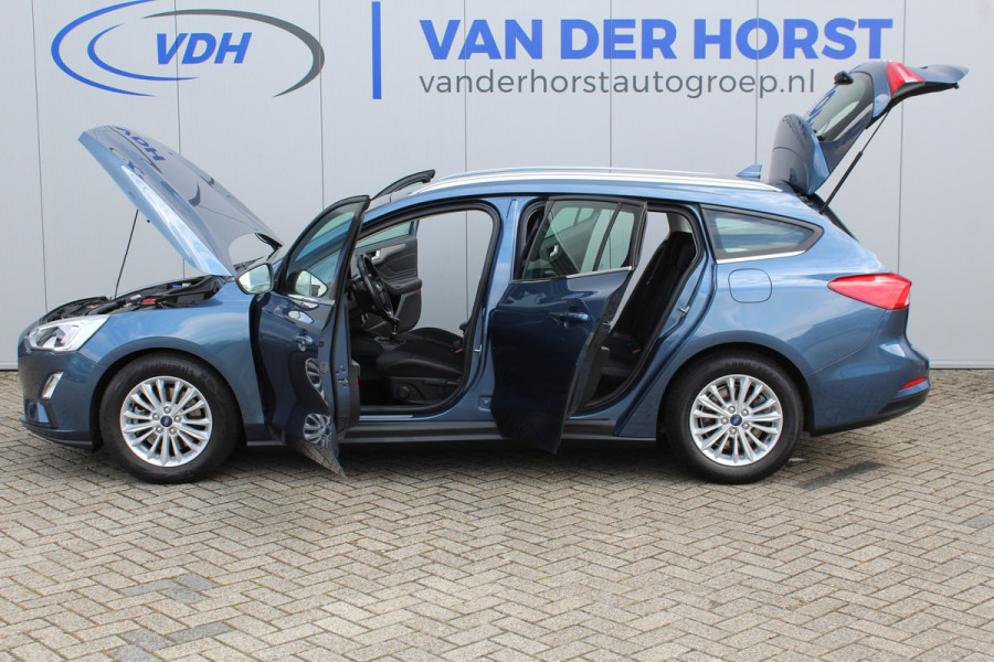 Ford FOCUS Wagon 1.0-125pk EcoBoost Titanium Business. Ruime, zeer geschikte gezinsauto ! Autm. airco dual, stoel-, stuur- en voorraamverw., LM wielen, trekhaak, metallic lak, navigatie, telefoonvoorb., cruise control etc