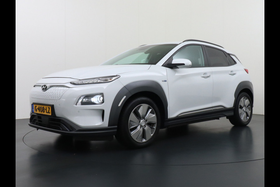 Hyundai Kona EV 64kWh 204pk Premium Leer Head-Up Display Apple Carplay Android Navi Camera Elektr.Stoelen+Verwarmd Adaptive Cruise/Stop&Go Ze Pdc Subwoofer Bluetooth Dodehoek detector Privacy Glas Rijstrooksensor