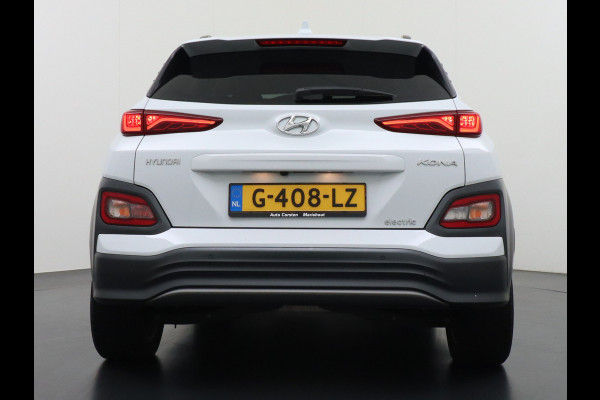 Hyundai Kona EV 64kWh 204pk Premium Leer Head-Up Display Apple Carplay Android Navi Camera Elektr.Stoelen+Verwarmd Adaptive Cruise/Stop&Go Ze Pdc Subwoofer Bluetooth Dodehoek detector Privacy Glas Rijstrooksensor