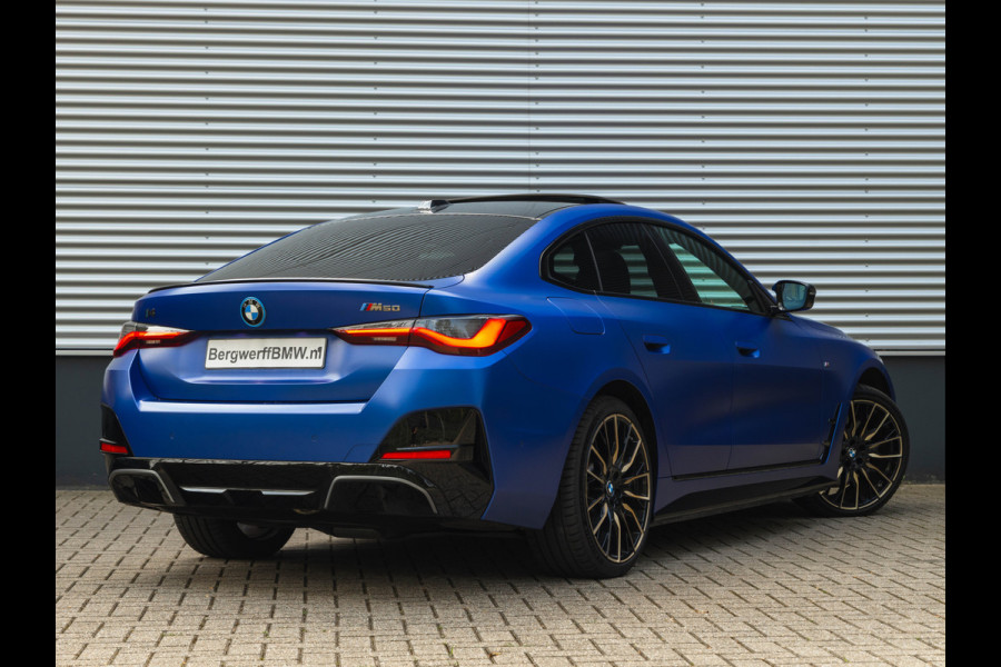 BMW i4 M50 - Dak - Memoryzetel - Trekhaak - Leder Dash - Driving + Parking Ass Prof