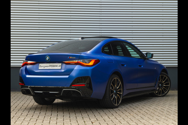 BMW i4 M50 - Dak - Memoryzetel - Trekhaak - Leder Dash - Driving + Parking Ass Prof