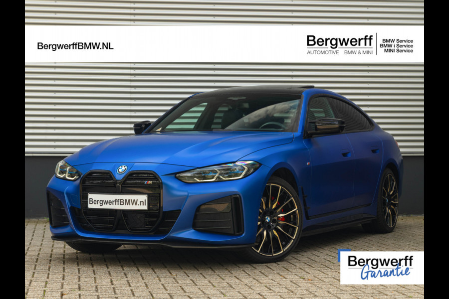 BMW i4 M50 - Dak - Memoryzetel - Trekhaak - Leder Dash - Driving + Parking Ass Prof