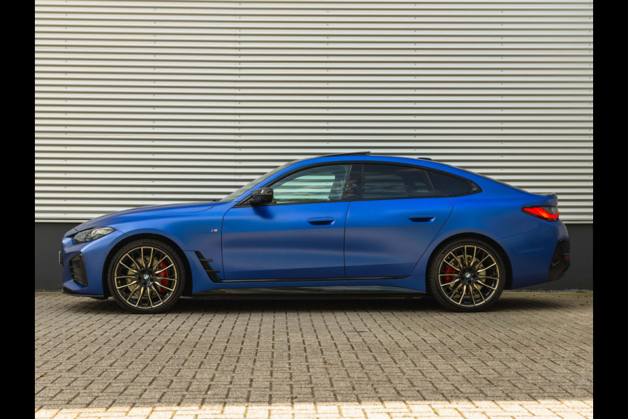 BMW i4 M50 - Dak - Memoryzetel - Trekhaak - Leder Dash - Driving + Parking Ass Prof