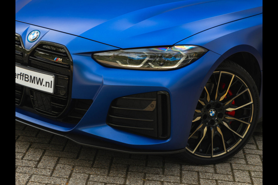 BMW i4 M50 - Dak - Memoryzetel - Trekhaak - Leder Dash - Driving + Parking Ass Prof