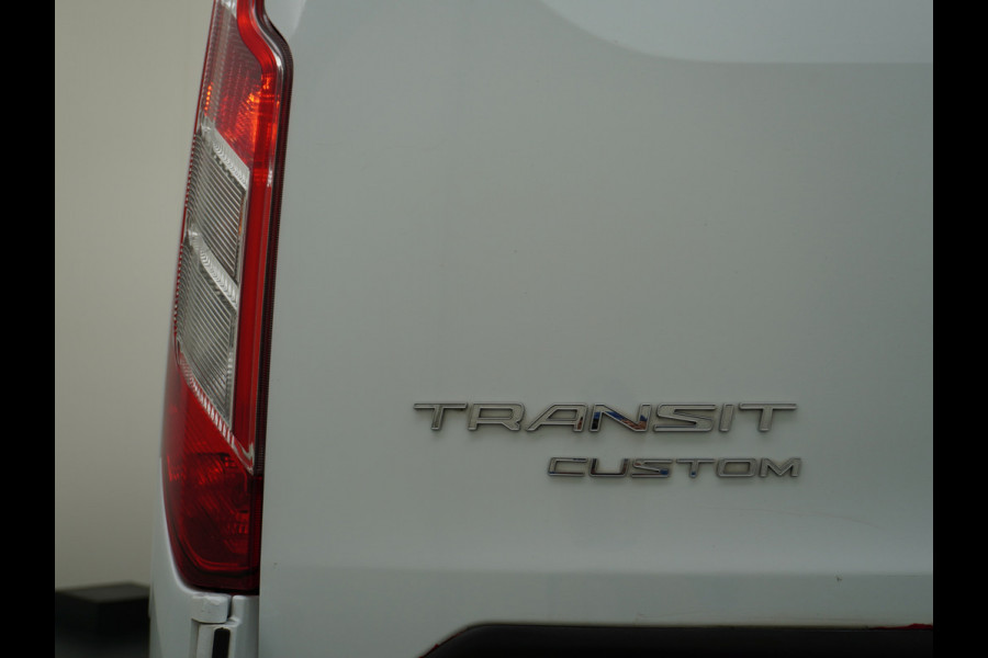 Ford Transit Custom 280 2.0TDCI 105PK L1H1 Airco Cruise Control Trekhaak PDC Bluetooth DAB 3-Persoons Trend Schuifdeur Betonplex Wandbetimmering Kastenbouw Euro 6 1e Eigenaar 2.500KG Trekgewicht