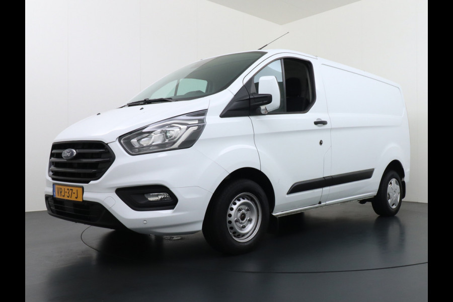 Ford Transit Custom 280 2.0TDCI 105PK L1H1 Airco Cruise Control Trekhaak PDC Bluetooth DAB 3-Persoons Trend Schuifdeur Betonplex Wandbetimmering Kastenbouw Euro 6 1e Eigenaar 2.500KG Trekgewicht