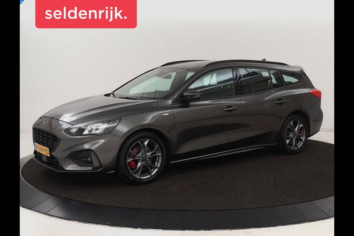 Ford Focus 1.5 EcoBoost ST Line | Stoel & stuurverwarming | Adaptive cruise | Trekhaak | Carplay | Keyless | Climate control | Navigatie | Full LED | Parkeerhulp Ford Focus 1.5 EcoBoost ST Line | Stoel & stuurverwarming | Adaptive cruise | Trekhaak | Carplay | Keyless | Climate control | Navigatie | Full LED | Parkeerhulp