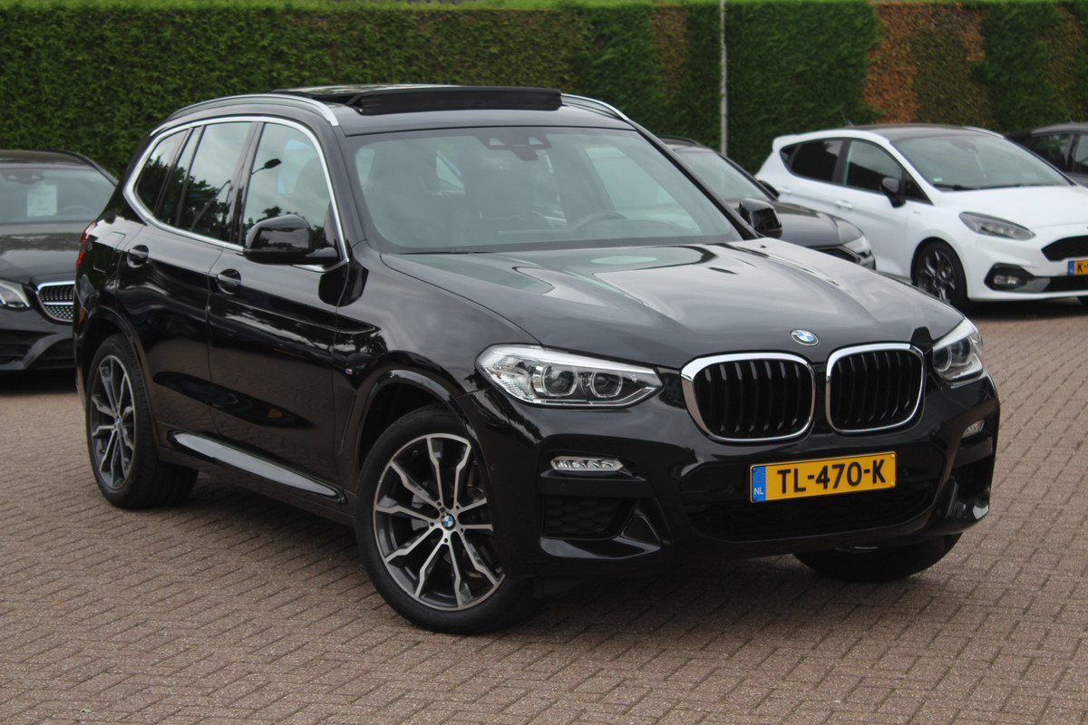 BMW X3 xDrive20i High Exe. M Sport / Trekhaak / Panoramadak / Camera / Leder / 20'' / Stuurverwarming / Navigatie / DAB / Stoelverwarming / Cruise Control BMW X3 xDrive20i High Exe. M Sport / Trekhaak / Panoramadak / Camera / Leder / 20'' / Stuurverwarming / Navigatie / DAB / Stoelverwarming / Cruise Control