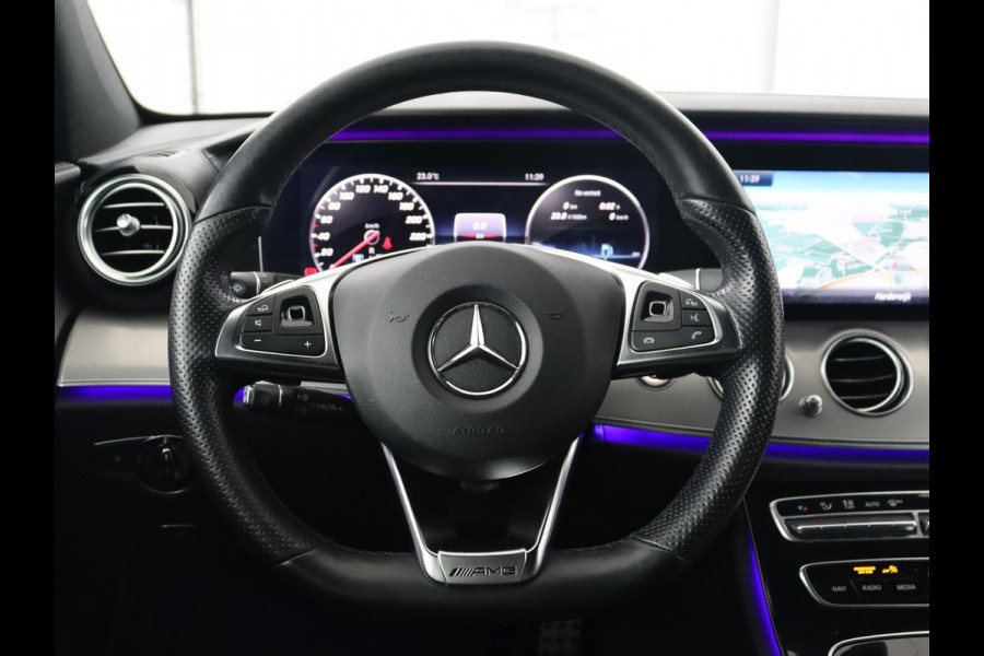 Mercedes-Benz E-Klasse 220d Business Solution AMG | Stoelverwarming | Trekhaak | Camera | Carplay | Widescreen | Half leder | Navigatie | Full LED