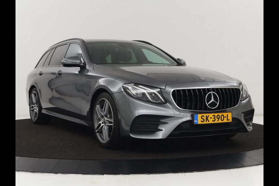 Mercedes-Benz E-Klasse 220d Business Solution AMG | Stoelverwarming | Trekhaak | Camera | Carplay | Widescreen | Half leder | Navigatie | Full LED