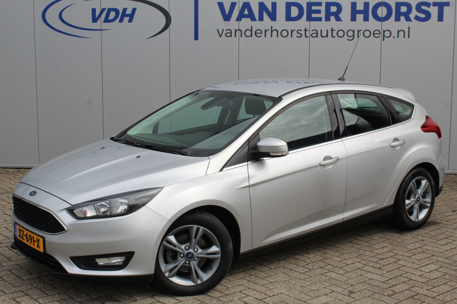 Ford Focus 1.0-125pk Titanium. Keurig nette Ford Focus hatchback met slechts 69.000km ! Autm. airco dual, cruise control, metallic lak, LM wielen,