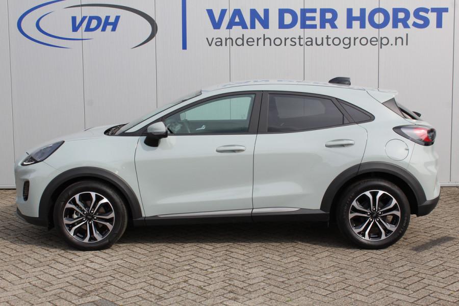 Ford Puma 1.0-125 pk EcoBoost Mild-Hybrid Titanium. Nieuw Model ! Fabrieksgarantie t/m 26-03-2029 ! Slechts 4.000km ! Stoel-, stuur- en voorraamverwarming, Side- en Lane assist, Adaptieve cruise control, Trekhaak afneembaar, LM wielen, Navigatie, telefoonvoorb.