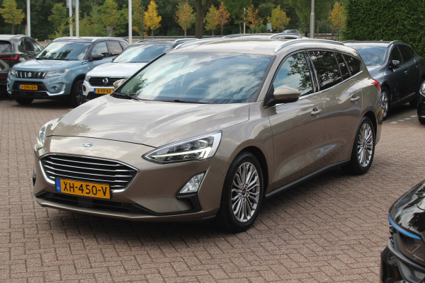 Ford FOCUS Wagon 1.0 EcoBoost Titanium Business / Trekhaak / Camera / B&O / 19'' / Keyless / Navigatie / Stuurverwarming / DAB / Stoelverwarming / Cruise Contro Ford FOCUS Wagon 1.0 EcoBoost Titanium Business / Trekhaak / Camera / B&O / 19'' / Keyless / Navigatie / Stuurverwarming / DAB / Stoelverwarming / Cruise Contro