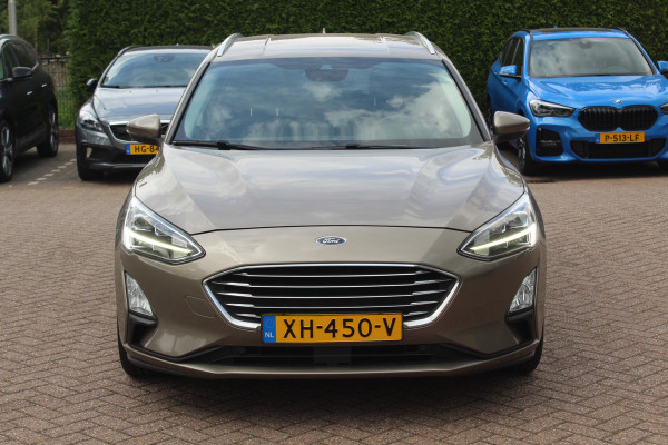 Ford FOCUS Wagon 1.0 EcoBoost Titanium Business / Trekhaak / Camera / B&O / 19'' / Keyless / Navigatie / Stuurverwarming / DAB / Stoelverwarming / Cruise Contro Ford FOCUS Wagon 1.0 EcoBoost Titanium Business / Trekhaak / Camera / B&O / 19'' / Keyless / Navigatie / Stuurverwarming / DAB / Stoelverwarming / Cruise Contro
