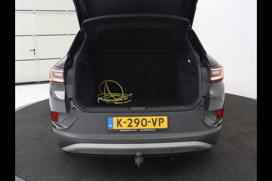 Volkswagen ID.4 Life 77 kWh | Trekhaak | Stoel & stuurverwarming | Camera | Adaptive cruise | Carplay | Navigatie | Parkeerhulp | Half leder