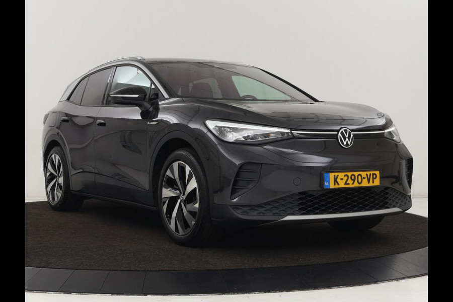 Volkswagen ID.4 Life 77 kWh | Trekhaak | Stoel & stuurverwarming | Camera | Adaptive cruise | Carplay | Navigatie | Parkeerhulp | Half leder