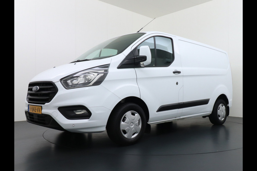 Ford Transit Custom 280 2.0TDCI 3-Persoons Airco Pdc-v+a Trekhaak Cruise Control Voorruitverwarming Trend Regen-Lichtsensor Betonplex Vloer Kastinrichting/Wandbetimmering Schuifdeur Euro 6 360NM Koppel 2.350Kg trekvermogen Zeer Compleet!