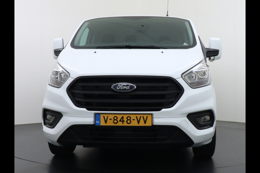 Ford Transit Custom 280 2.0TDCI 3-Persoons Airco Pdc-v+a Trekhaak Cruise Control Voorruitverwarming Trend Regen-Lichtsensor Betonplex Vloer Kastinrichting/Wandbetimmering Schuifdeur Euro 6 360NM Koppel 2.350Kg trekvermogen Zeer Compleet!