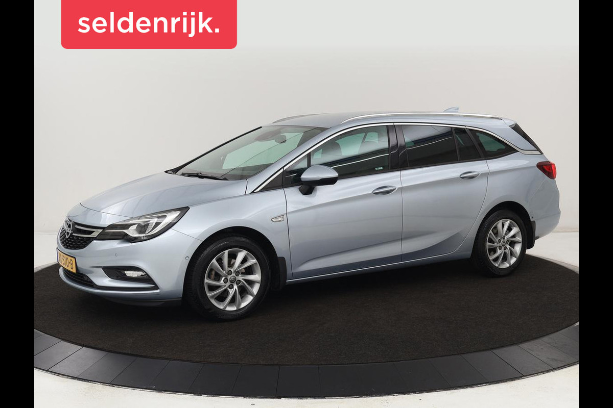 Opel Astra 1.0 Turbo Innovation | Leder | Stoel & stuurverwarming | Trekhaak | Camera | Matrix LED | Navigatie | Carplay | Comfortstoelen | Keyless | Park Assist | Climate control Opel Astra 1.0 Turbo Innovation | Leder | Stoel & stuurverwarming | Trekhaak | Camera | Matrix LED | Navigatie | Carplay | Comfortstoelen | Keyless | Park Assist | Climate control
