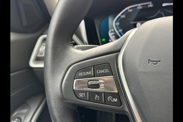 BMW 3 Serie Touring 320e High Executive Automaat | Trekhaak elektrisch | Navigatiesysteem | Laser LED | Draadloze telefoonlader | Apple CarP