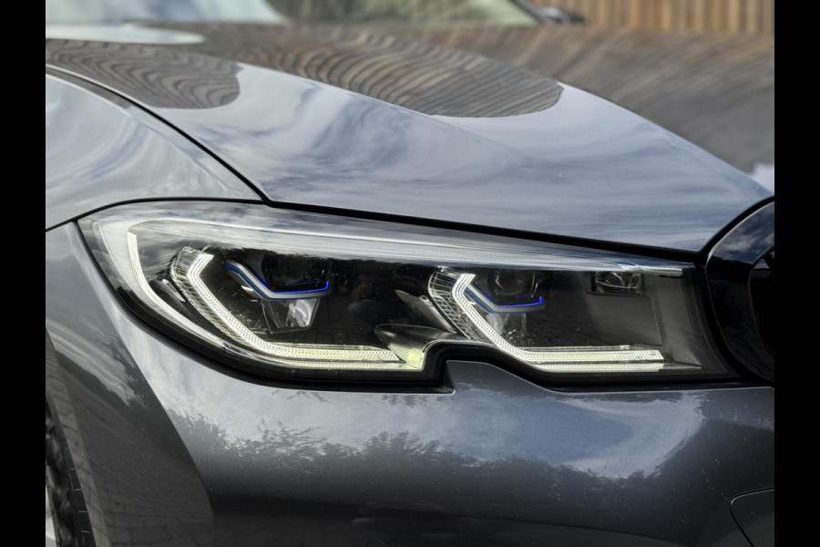 BMW 3 Serie Touring 320e High Executive Automaat | Trekhaak elektrisch | Navigatiesysteem | Laser LED | Draadloze telefoonlader | Apple CarP