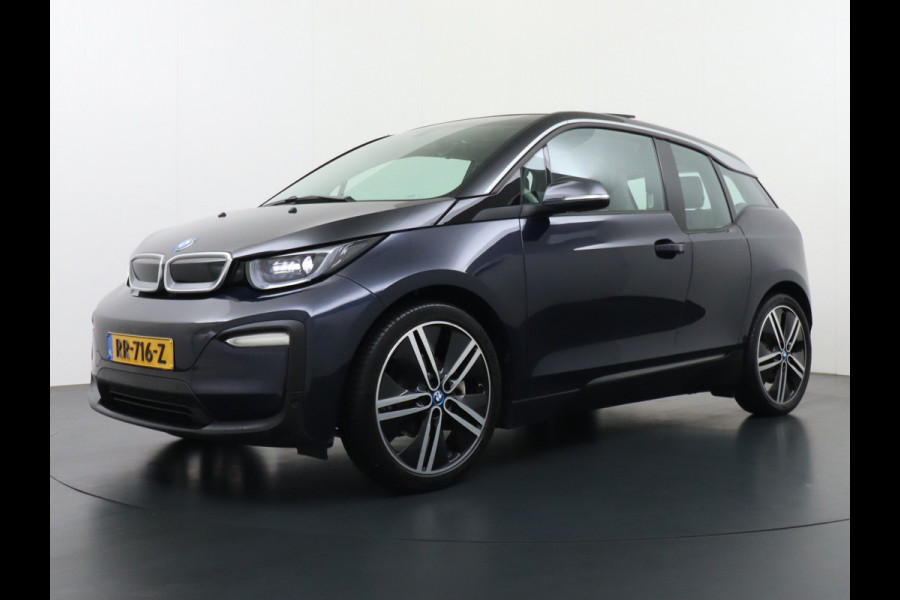 BMW i3 S iPerformance 94Ah 33kWh Schuifkanteldak Navi Ecc Cruise Control Camera Pdc DAB Stoelverwarming Warmtepomp Lmv 20" Led Comfort pack advance Origineel Nederlandse Auto