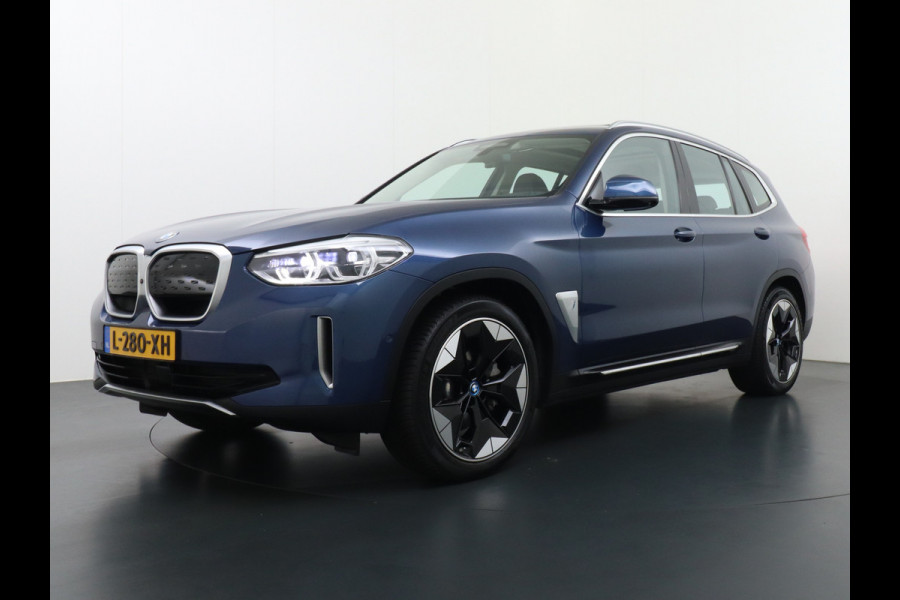 BMW iX3 High Executive 80kWh Leder Adap.Cruise Apple Carplay Android Auto Navi Ecc 360°Camera Panoramaschuifdak Harman&Kardon®SurroundSo Stoelverwarming Parkeer+Achteruitrij assistent Led Origineel Nederlandse Auto Zeer compleet!