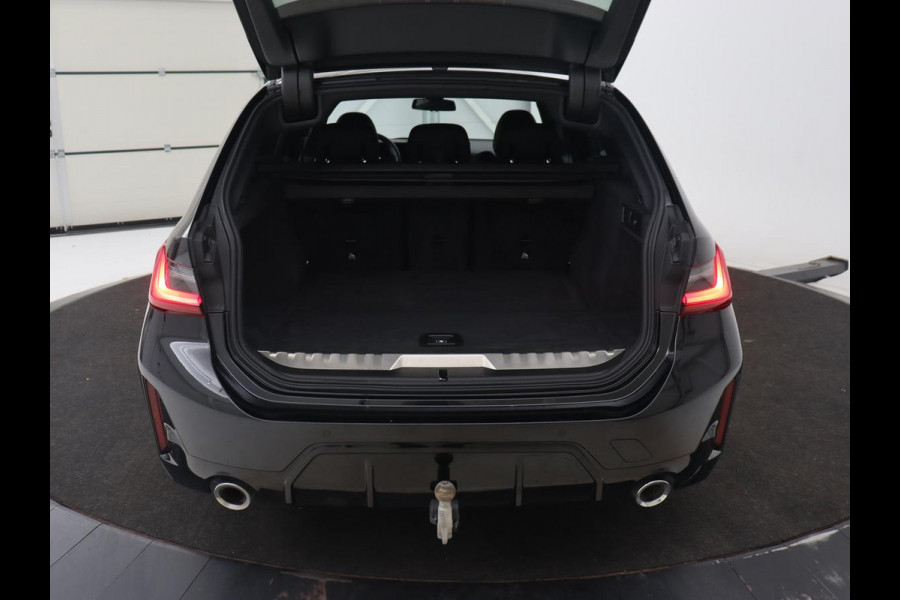 BMW 3 Serie Touring 330e Business Edition Plus | Wegklapbare trekhaak | Camera | Stoel & Stuurverwarming | Carplay | Leder