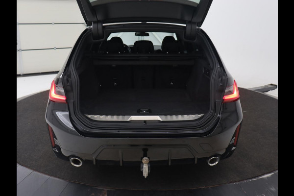 BMW 3 Serie Touring 330e Business Edition Plus | Wegklapbare trekhaak | Camera | Stoel & Stuurverwarming | Carplay | Leder
